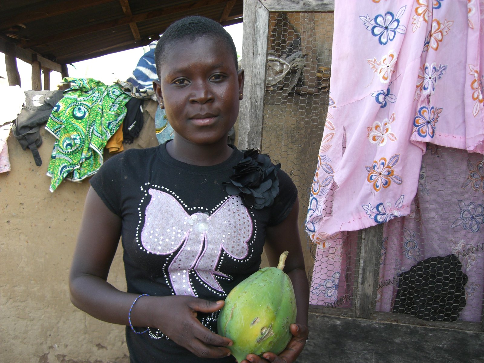 Alisah Yuseff of Larabanga holding a papaya